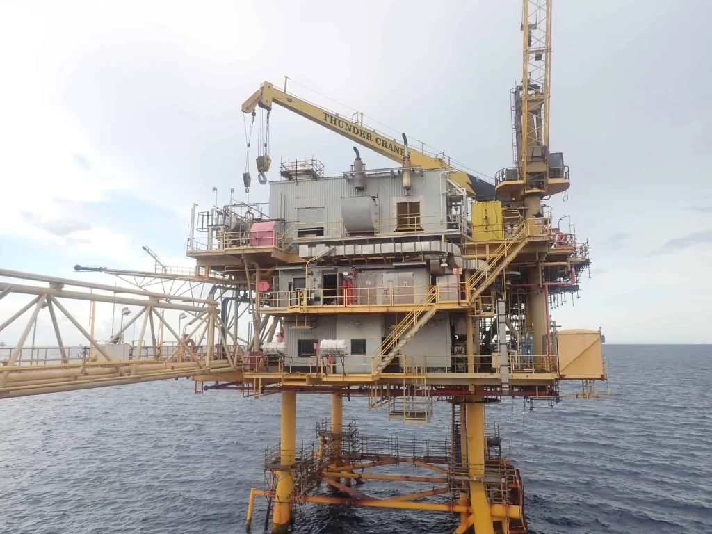 Thunder Crane TC90 equipment performing offshore platform decommissioning topside operations on ocean rig